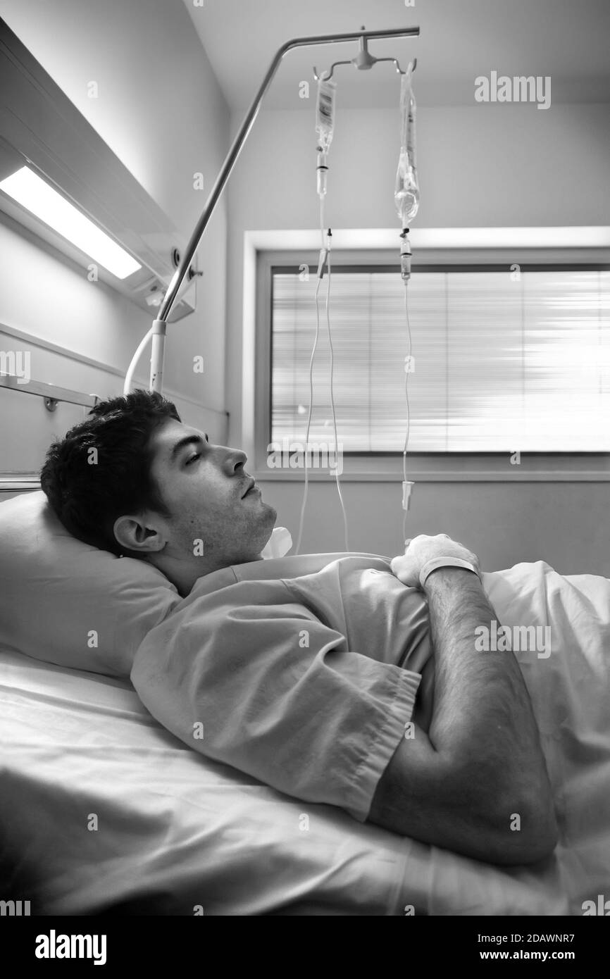 Sick man in bed hospital, disease and infection Stock Photo