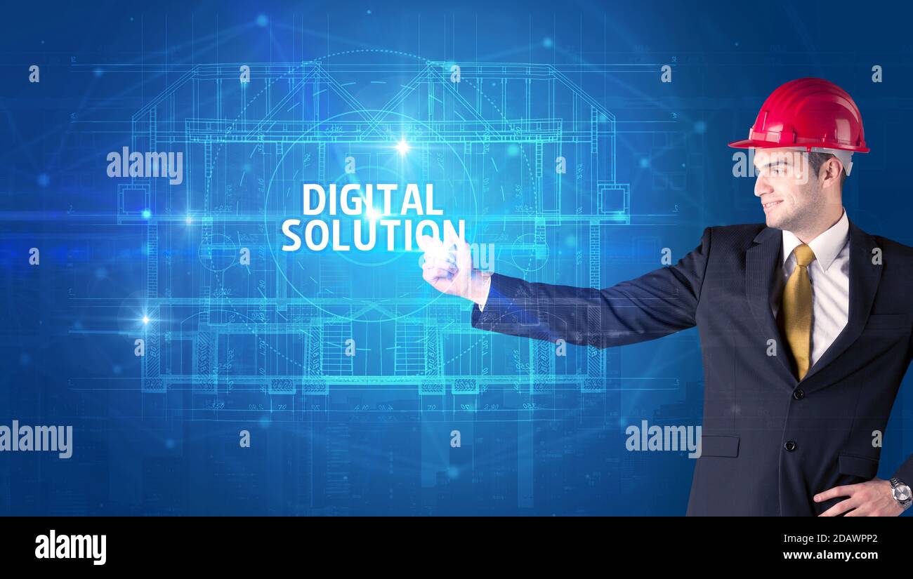 Handsome architect with helmet drawing DIGITAL SOLUTION inscription ...