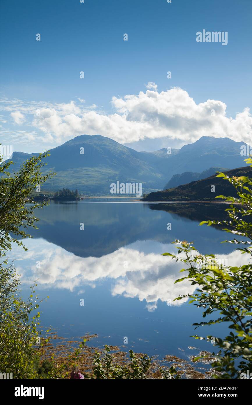 Beautiful reflections on Loch Long near Dornie in the Scottish Highlands. Stock Photo