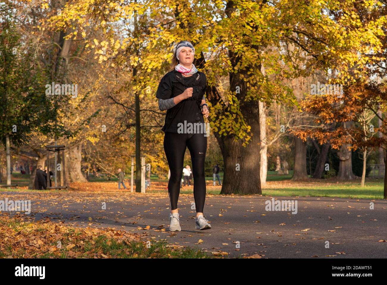 11/14/2020. Park Stromovka. Prague czech Republic. A woman is running in the park on a Sunday winter day. Stock Photo