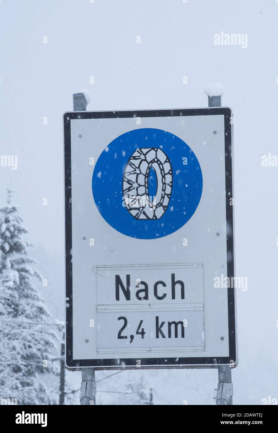 snow chain obligation traffic sign in the mountains in winter Stock Photo