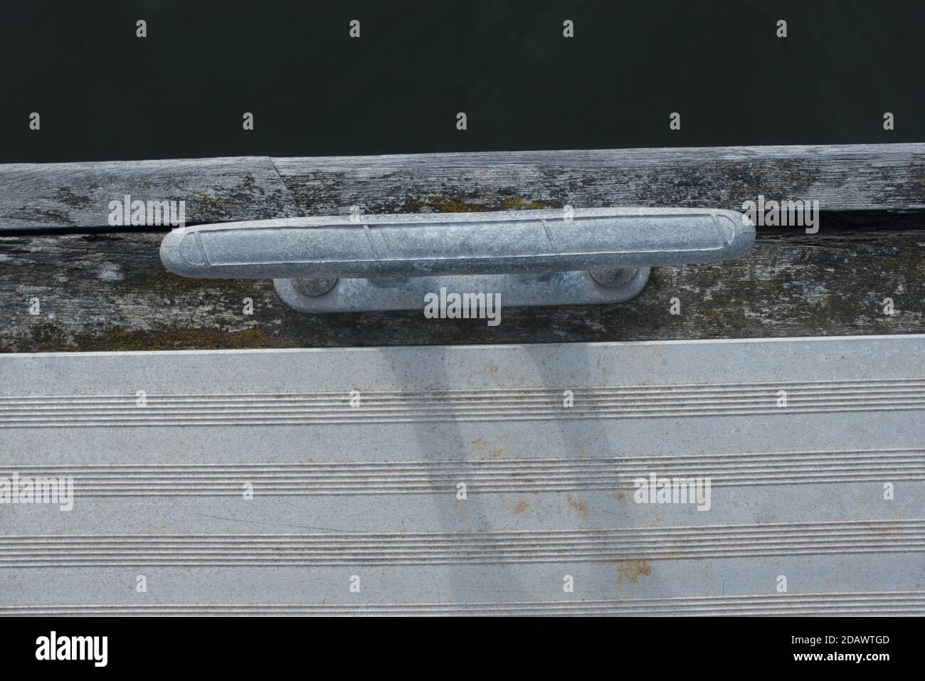 A cleat on a marina pontoon for making fast a yacht or boat Stock Photo