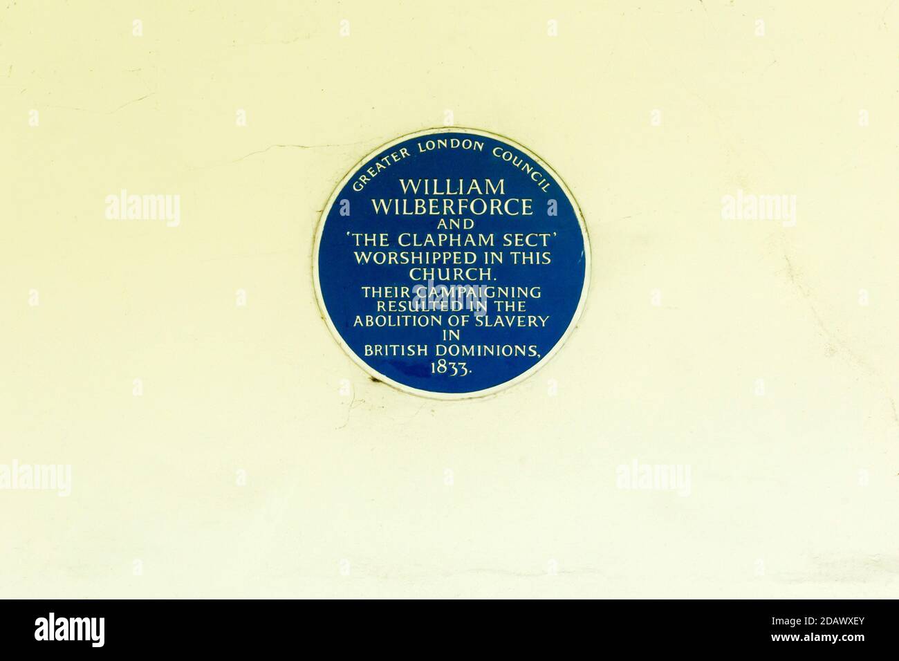 A GLC Blue plaque commemorating William Wilberforce, the Clapham Sect & the abolition of slavery on Holy Trinity Church, Clapham Common. Stock Photo