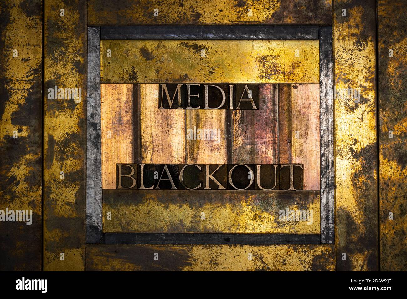 Media Blackout text on vintage textured grunge copper and gold background Stock Photo