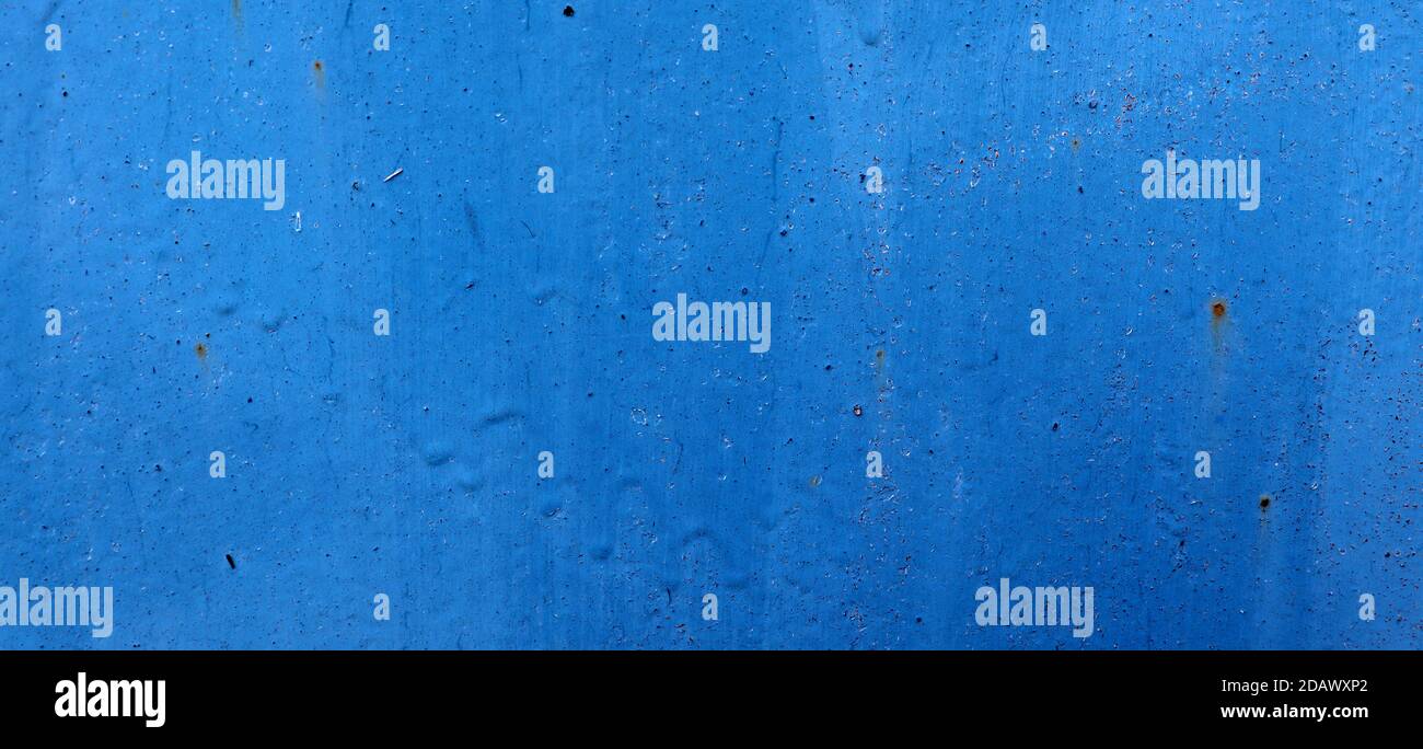 Background with blue paint on rust metal. Abstract old cracked wall texture Stock Photo