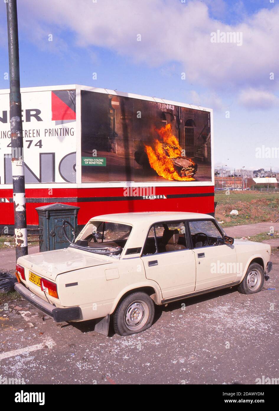 Glasgow, Scotland, UK Scanned 645 Slide Lada Car Vandelised next to burning  Benetton Sign Stock Photo - Alamy