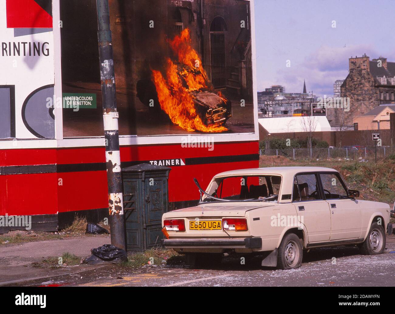 Glasgow, Scotland, UK Scanned 645 Slide Lada Car Vandelised next to burning Benetton Sign Stock Photo