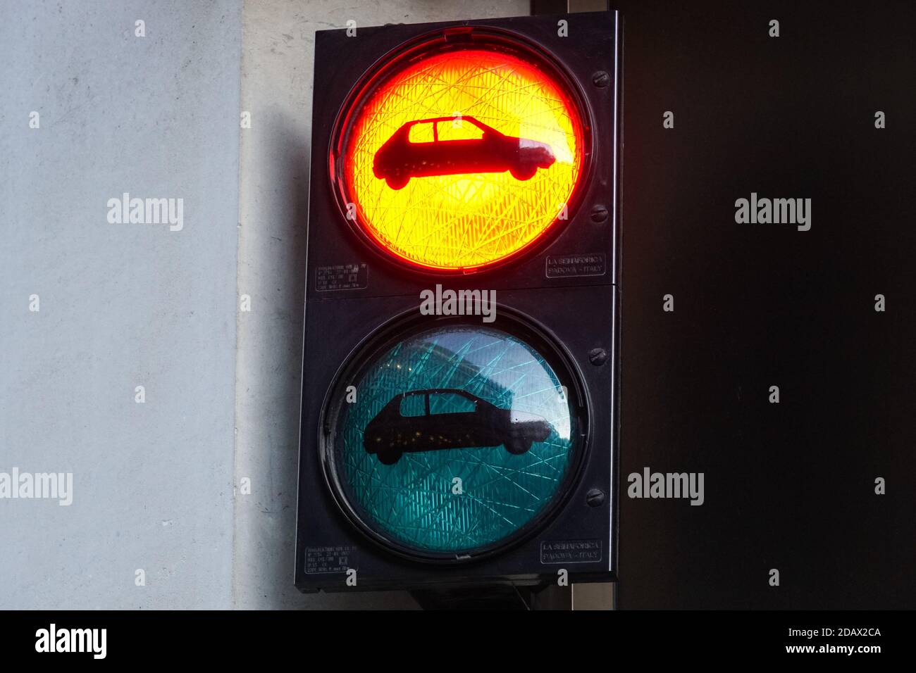 Red traffic light for cars at the exit of the parking Stock Photo