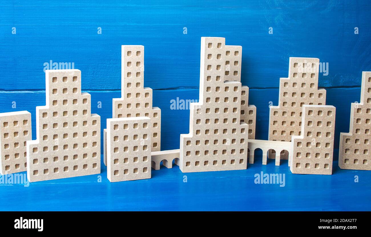 City of figures of buildings on a blue background. Concept for real