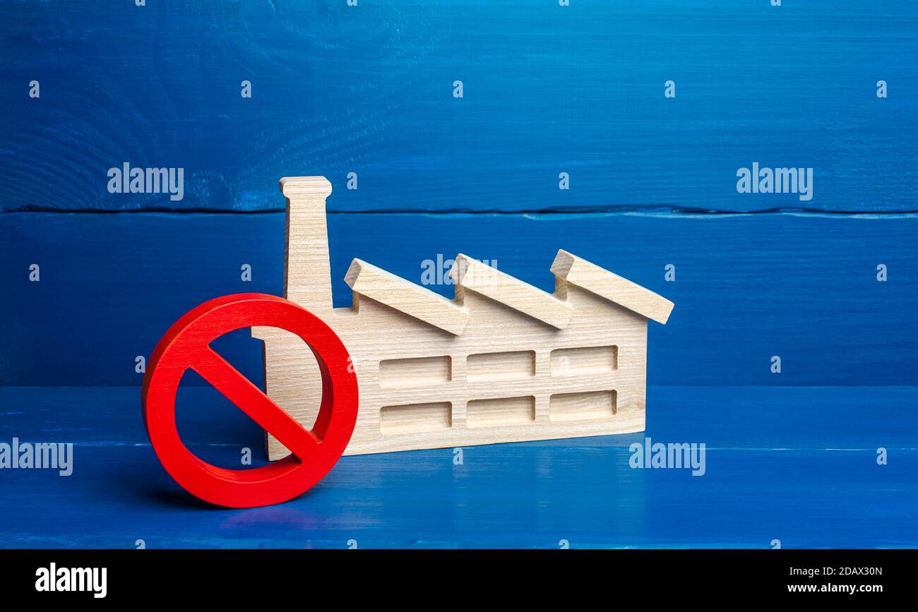 Factory industrial plant and red prohibition symbol NO. Free zone from harmful heavy industry. Environmental quotas and restrictions on environmental Stock Photo