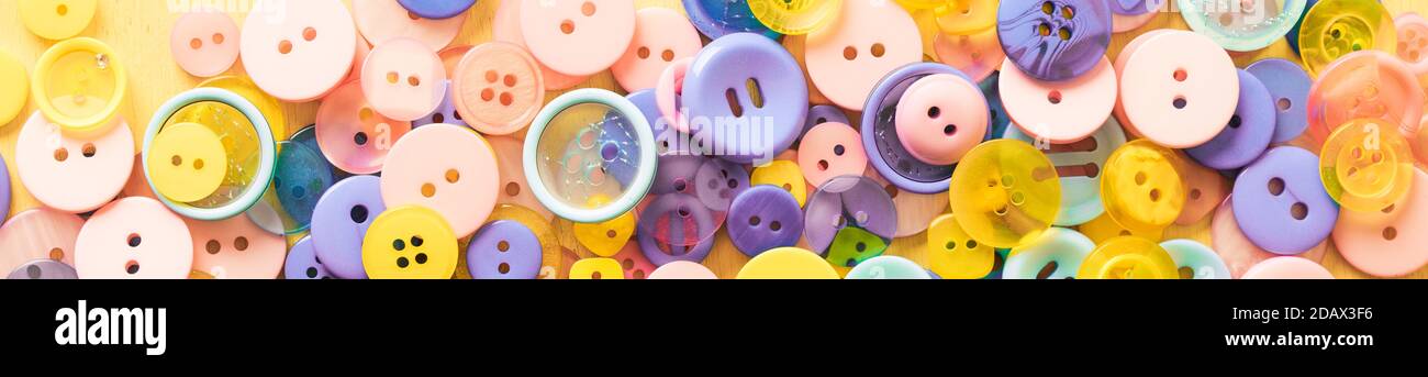 Multi-colored Plastic Buttons. Long Banner Stock Photo