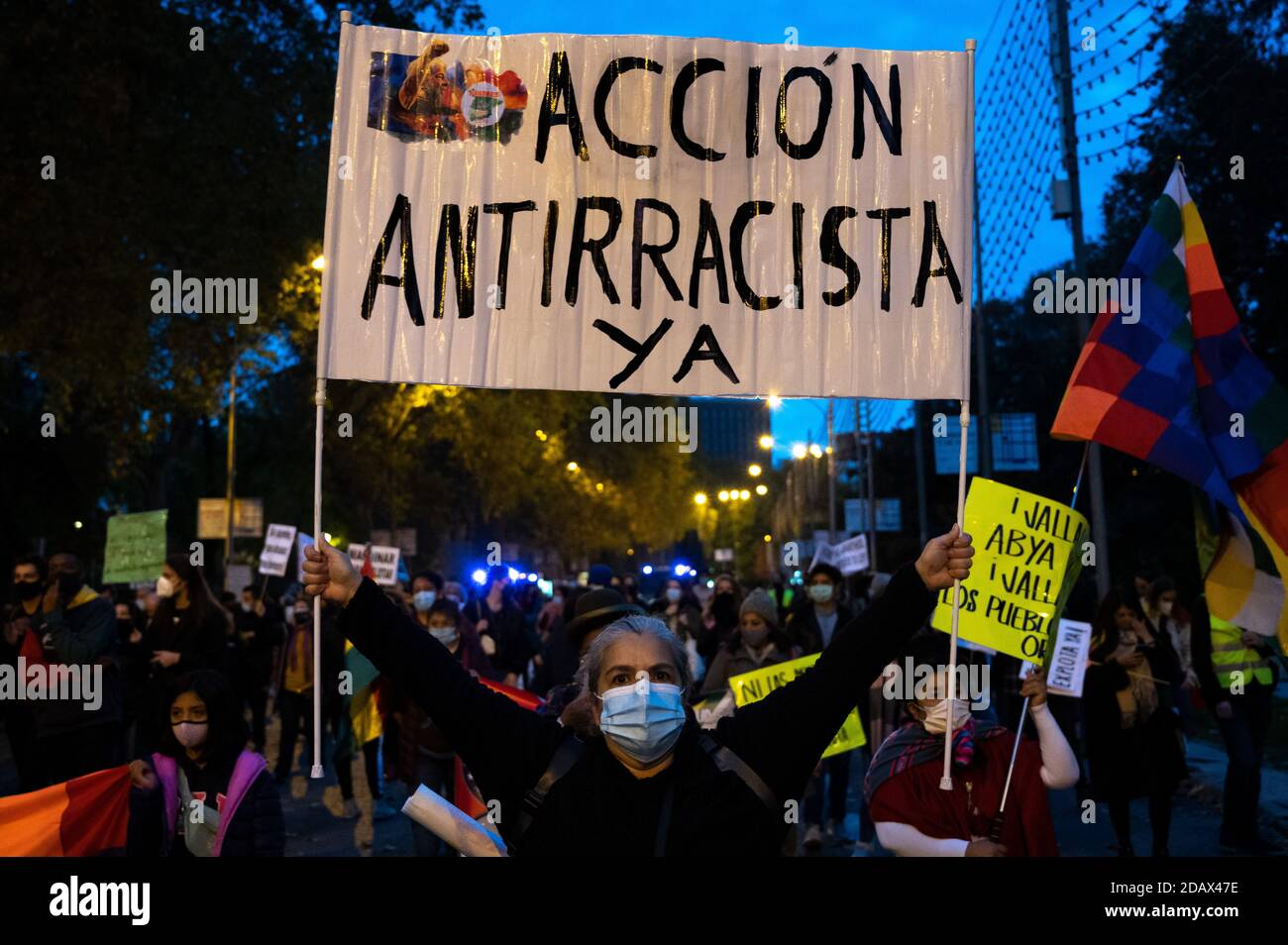 Madrid, Spain. 15th Nov, 2020. A woman carrying a banner reading 'Anti-racist action now' during a protest against racism and xenophobia. Credit: Marcos del Mazo/Alamy Live News Stock Photo
