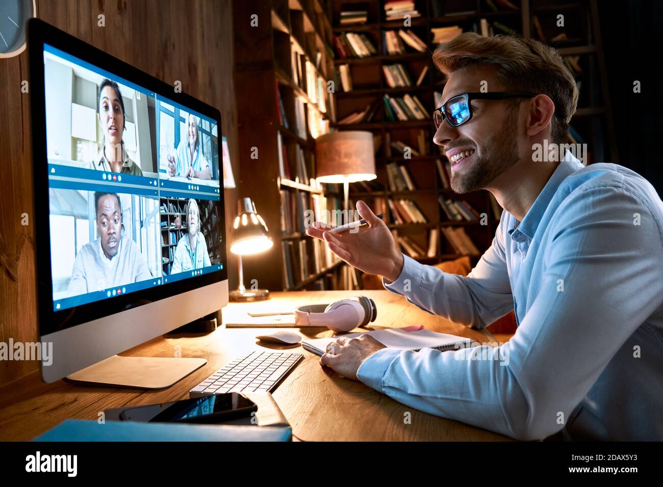 Businessman having virtual team meeting on video conference call using computer. Stock Photo