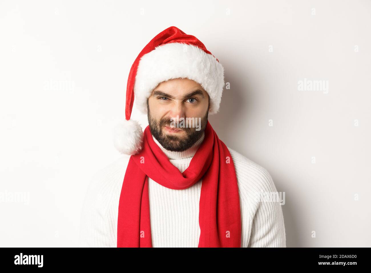 New Year party and winter holidays concept. Close-up of grumpy guy in ...