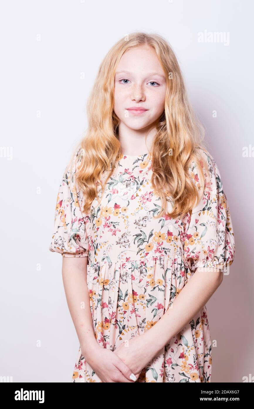 Portrait of a young, fair-haired girl wearing a Summer dress Stock Photo -  Alamy