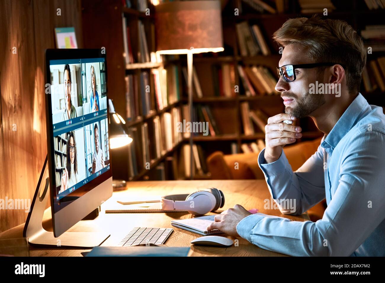 Businessman having virtual team meeting on video conference call using computer. Stock Photo
