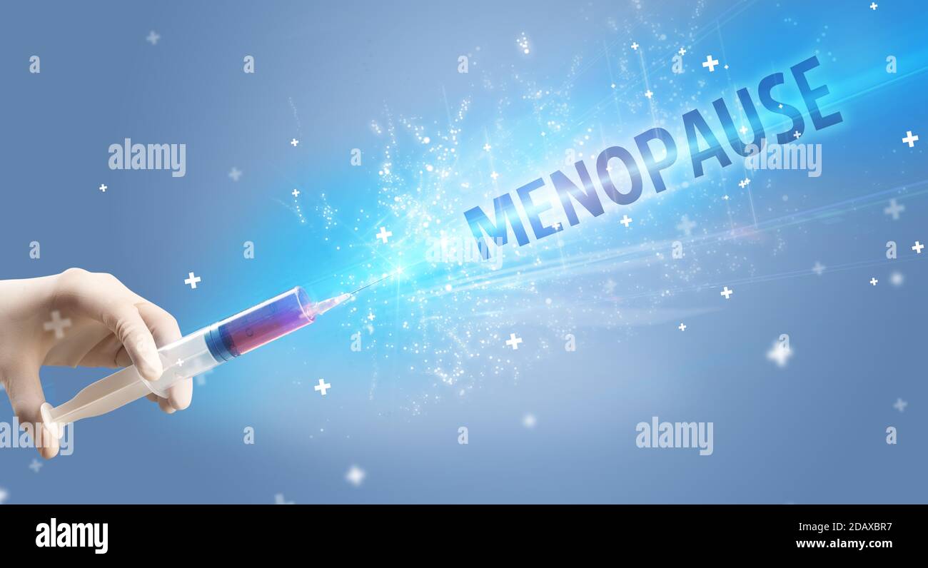 Syringe, medical injection in hand with MENOPAUSE inscription, medical