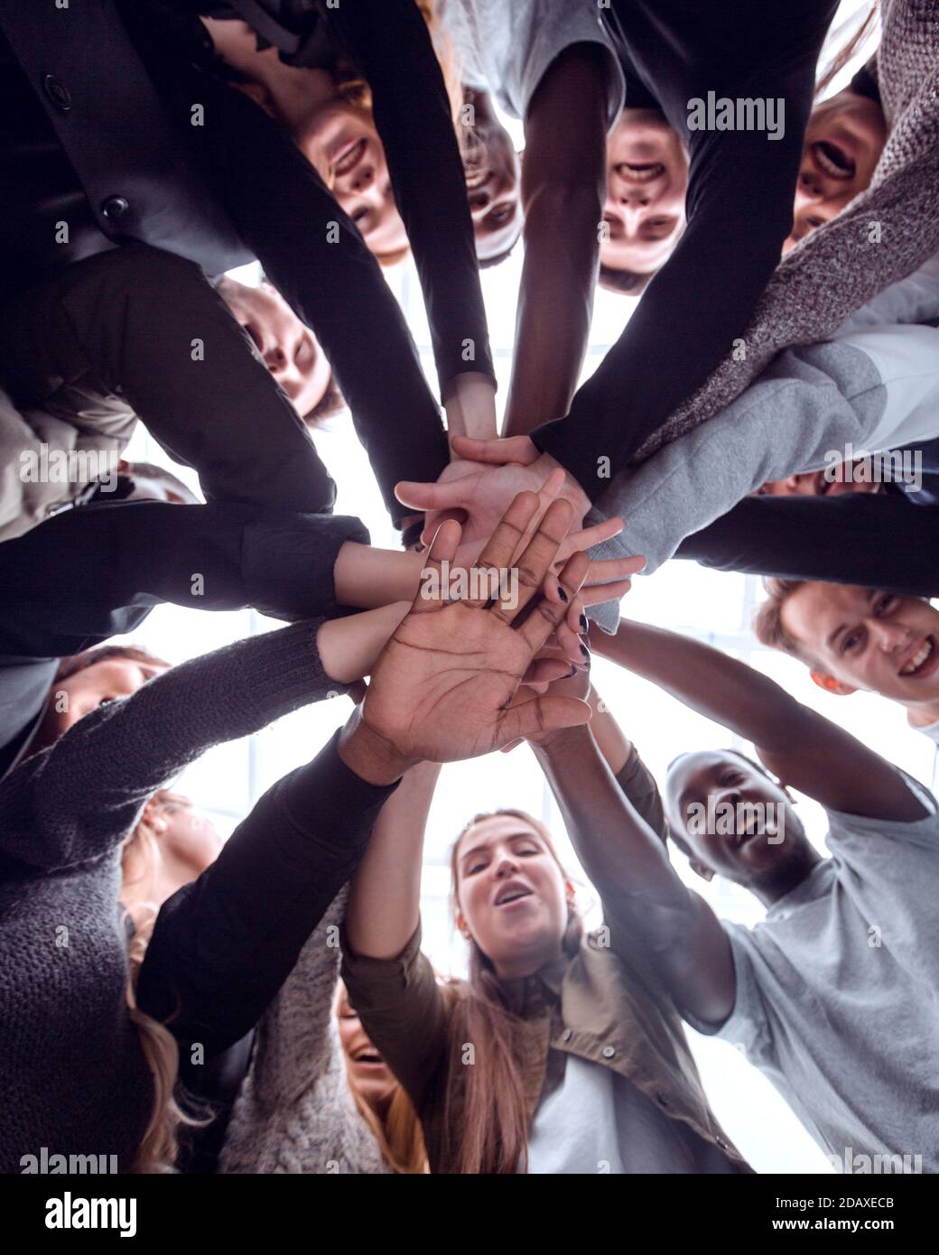 bottom view. group of happy young people making a stack of hands Stock ...