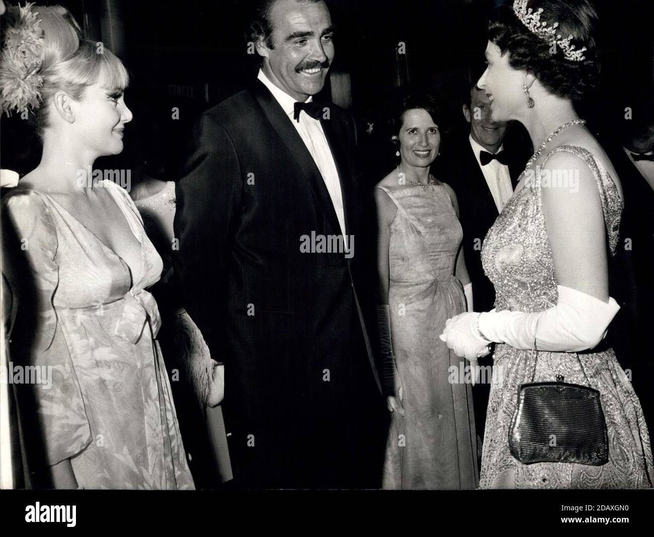 Jun. 12, 1967 - London, England, United Kingdom - Queen ELIZABETH, right, last night attended the premiere of the new James Bond film 'You Only Live Twice' at the Odeon, Leicester Square. H.M. The Queen, right, meets actress DIANE CILENTO, left, and her husband SEAN CONNERY, center, during the charity premiere.(Credit Image: © Keystone Press Agency/Keystone USA via ZUMAPRESS.com) Stock Photo