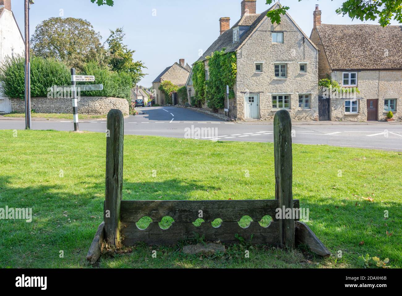 Ancient wooden stocks on Village Green, Islip, Oxfordshire, England, United Kingdom Stock Photo