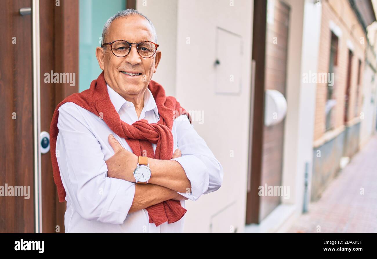 Senior man smiling happy standing at new home Stock Photo - Alamy