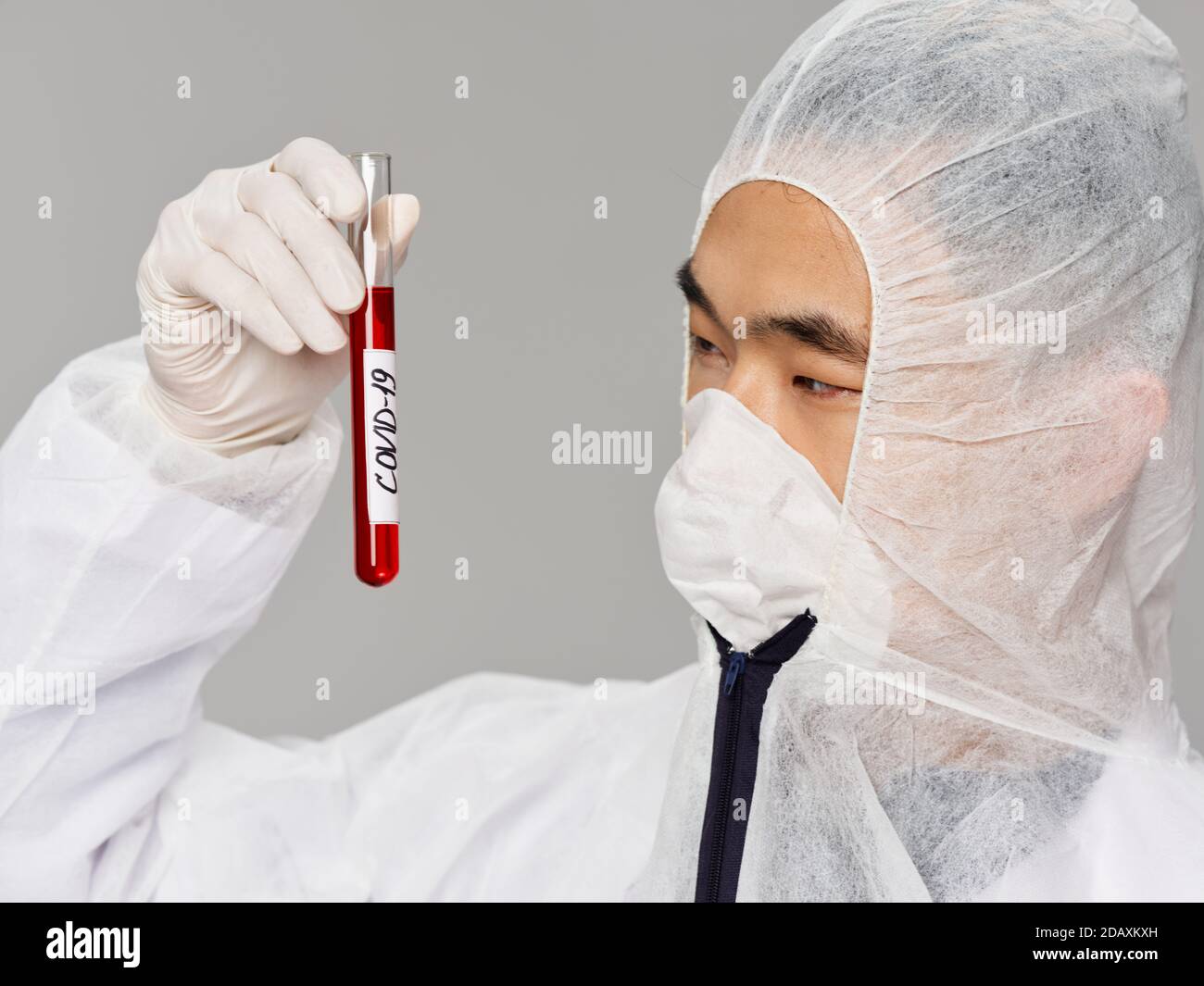 asian male protective clothing analysis testing diagnostics Stock Photo