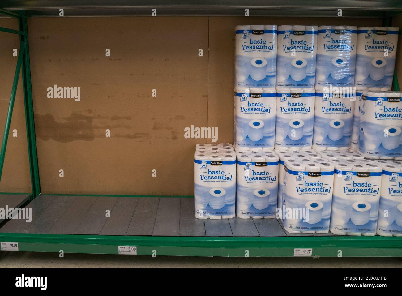 toilet paper supermarket shelf is half empty in canada due to covid 19