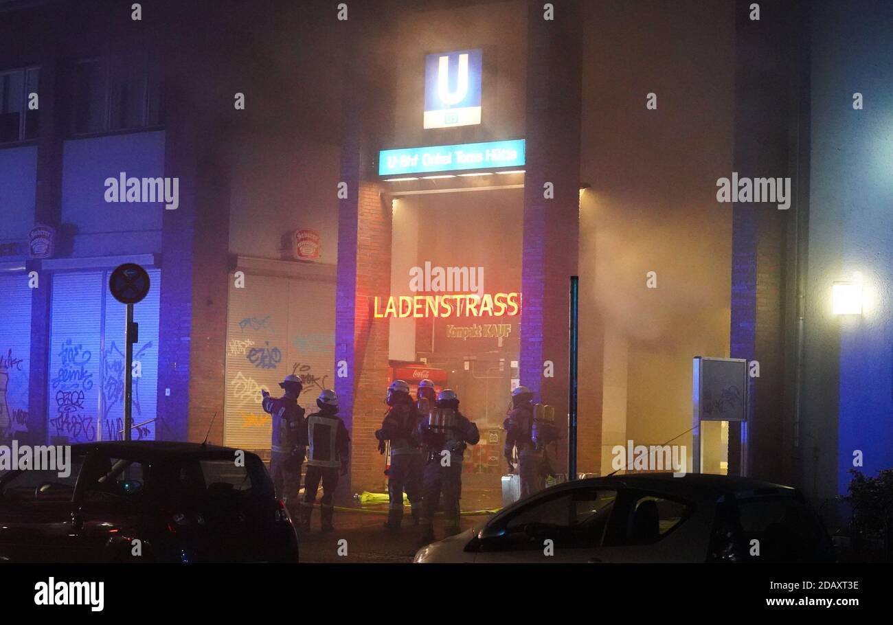 Berlin, Germany. 15th Nov, 2020. Firefighters extinguish a fire in the row of shops in the Uncle Tom's Hut subway station. Credit: Jörg Carstensen/dpa/Alamy Live News Stock Photo