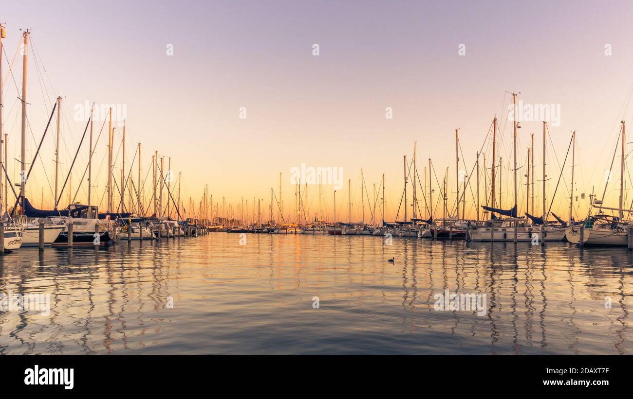 Dutch harbour with sailing boats at sunrise in silence Stock Photo - Alamy