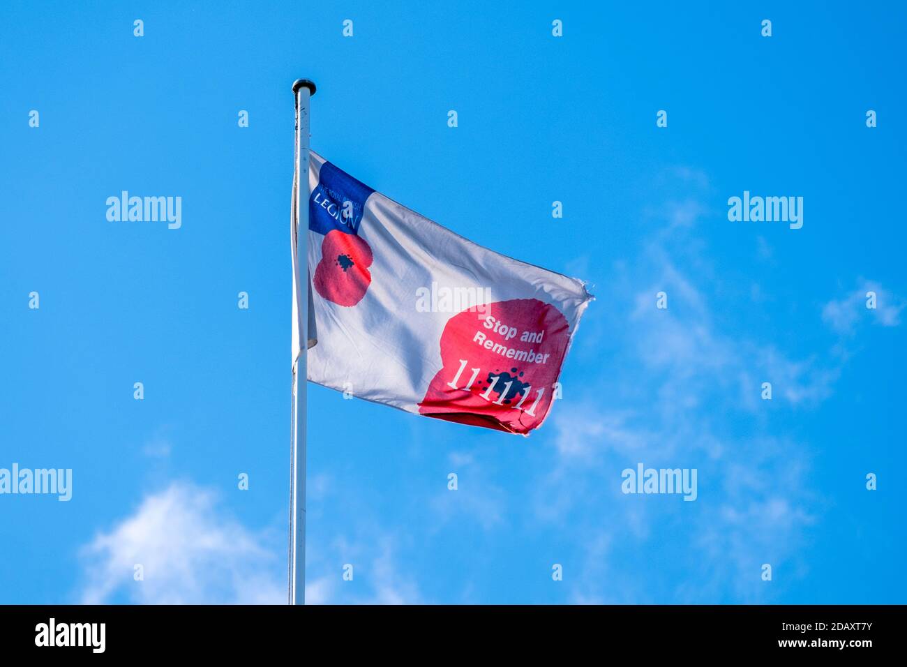 The Royal British Legion flag flying for Remembrance Sunday  On a church tower,  Suffolk, UK. Stock Photo