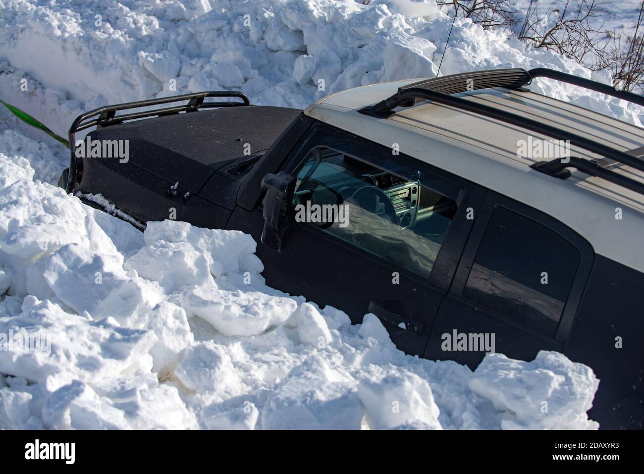 Winter off road in forest. Jeep car offroad adventure in the Snow Mountain. Stock Photo