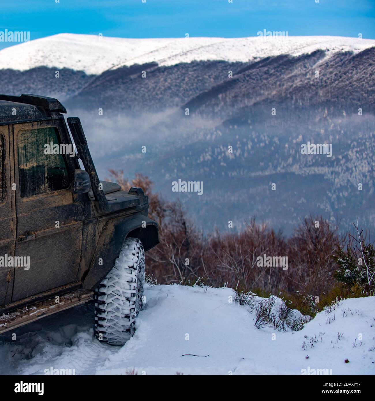 Winter offroad. Car tires on winter road covered with snow Stock Photo
