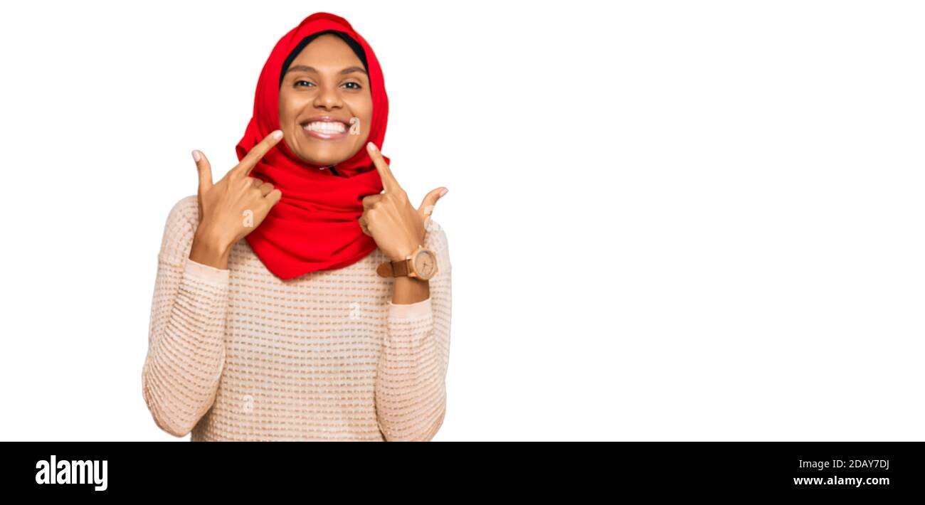 Young african american woman wearing traditional islamic hijab scarf