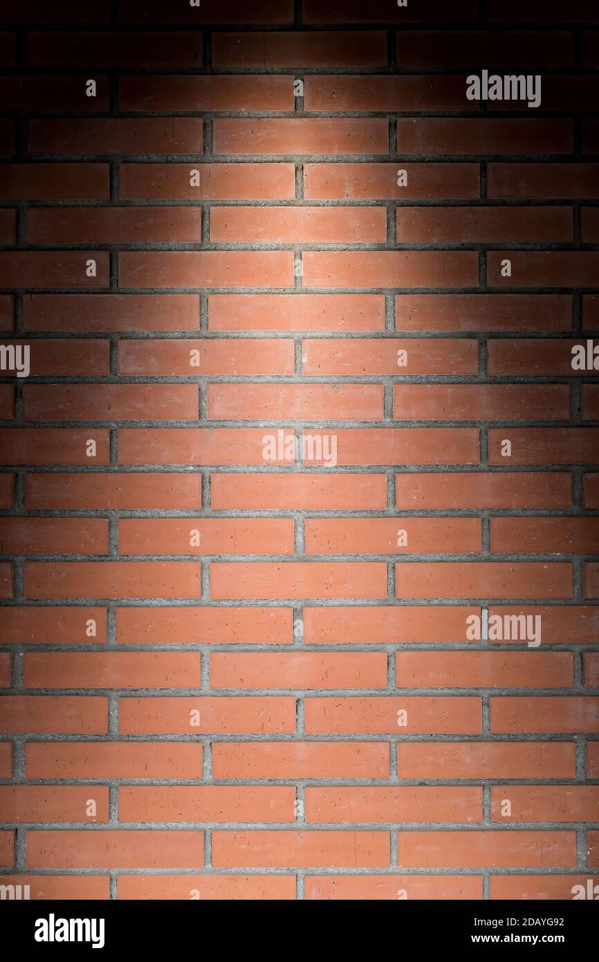 Vertical brick wall texture with light from above Stock Photo Alamy