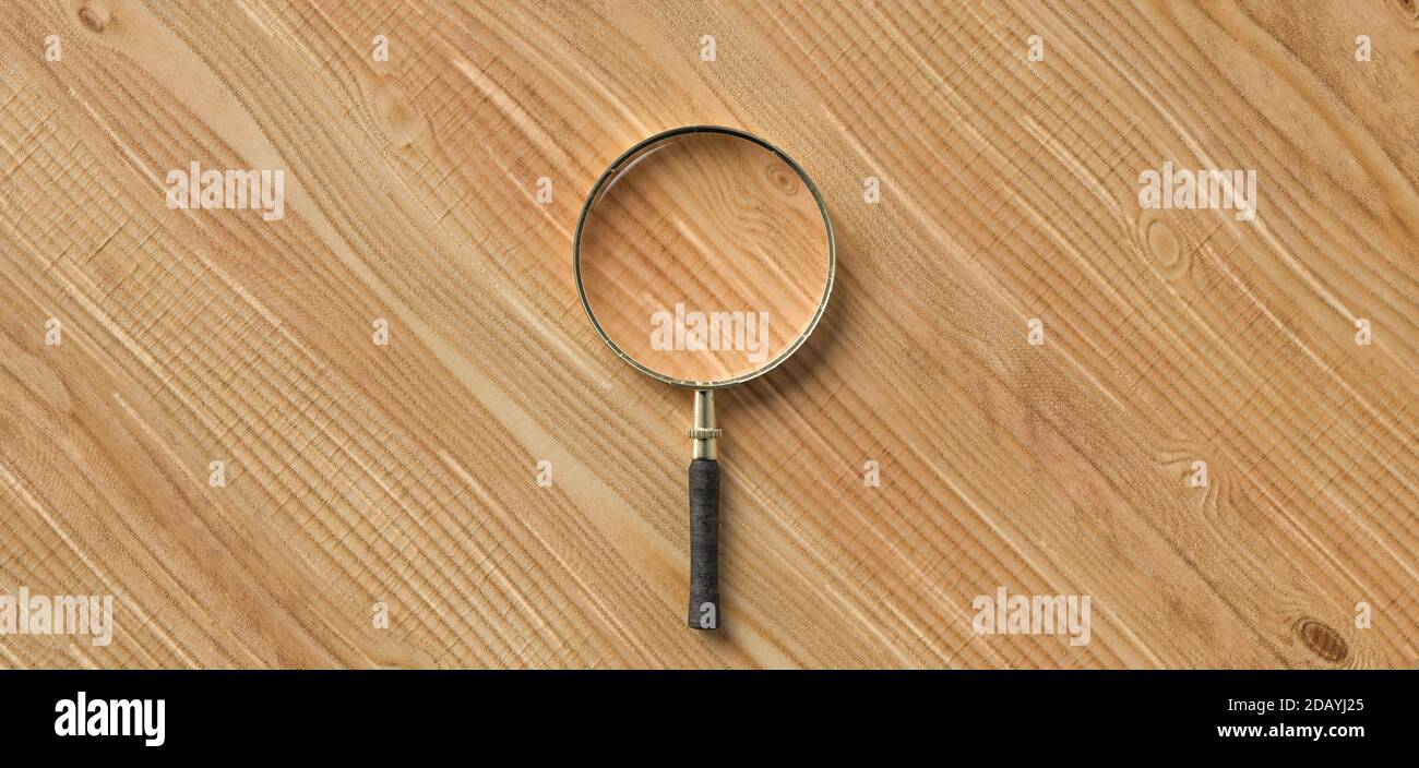 centered magnification glass on empty wooden background - 3d