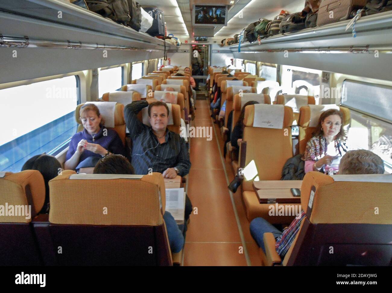 Passengers on AVE high-speed bullet train in Spain Stock Photo