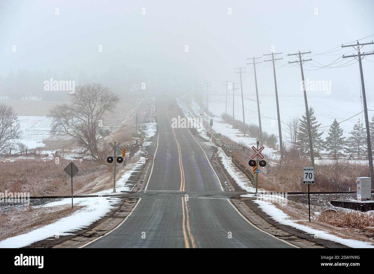 Fog covered 2 lane highway Stock Photo