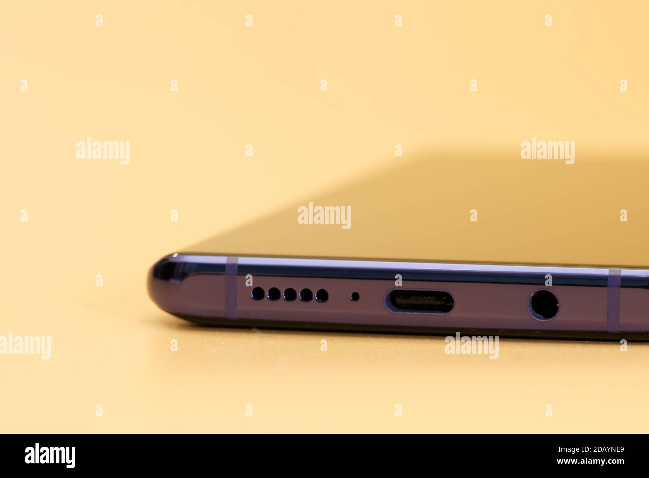 bottom side of phone with mic, 3,5mm jack audio port and usb type-c charger port Stock Photo