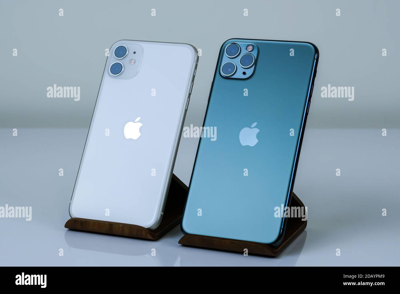 Iphone 11 Pro Max In Midnight Green Next To Iphone 11 In White Stock Photo Alamy