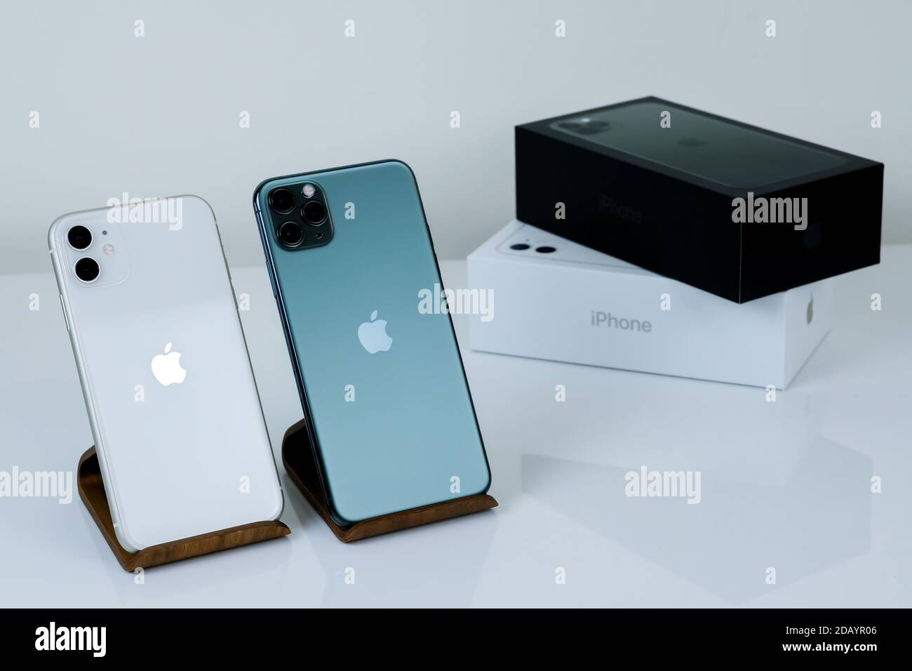 Iphone 11 Pro Max In Midnight Green Next To Iphone 11 In White Stock Photo Alamy