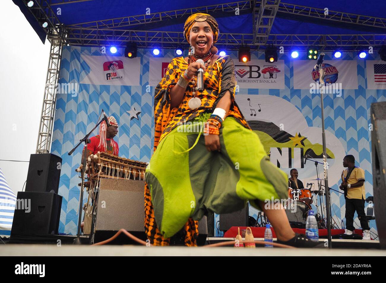 Yvonne Mwale, a singer from Zambia, performs music on a stage in Democratic Republic of Congo. Stock Photo