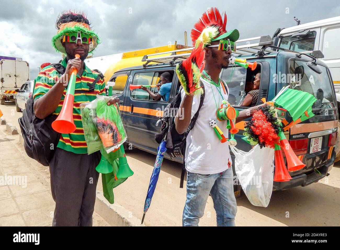 Vendors Simon Phiri (left) and Amon Kabamba sell a variety of items before the start of the Zambia-Egypt football game during the Total U-20 Africa Cup of Nations, held at National Heroes Stadium in Lusaka, Zambia. Stock Photo
