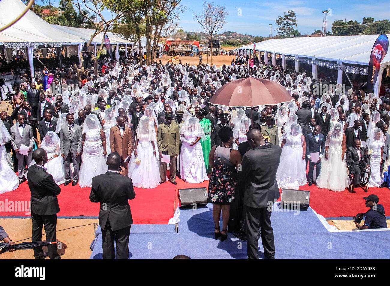At the Rubaga Miracle Centre Cathedral in Kampala, Uganda, 280 couples stand before Pastor Robert Kayanja, their families and friends to take wedding vows. Stock Photo