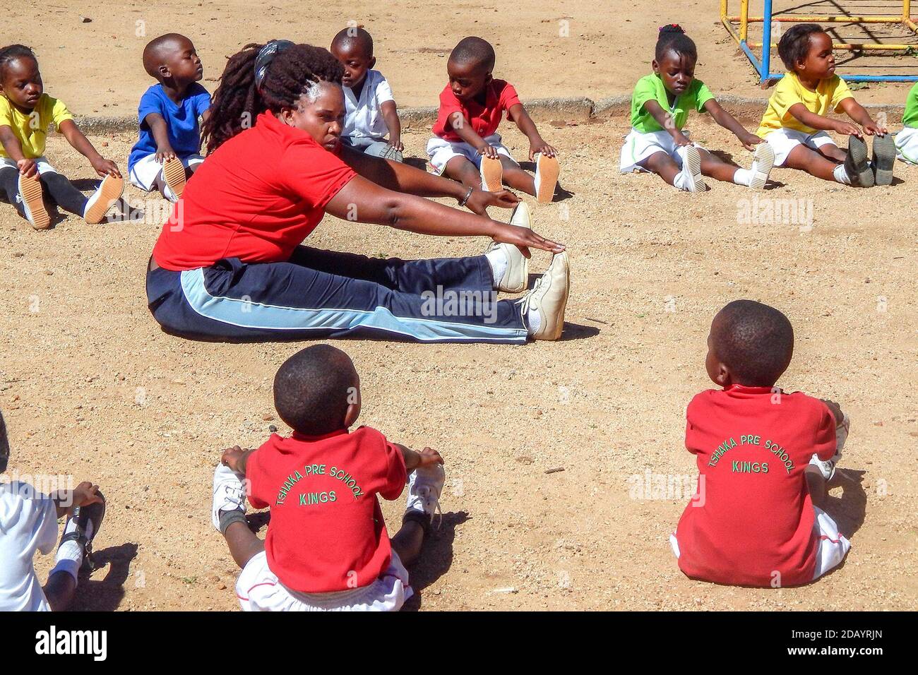 Preschoolers in Mzilikazi, a suburb of Bulawayo, Zimbabwe’s second-largest city, participate in a physical education class. Stock Photo