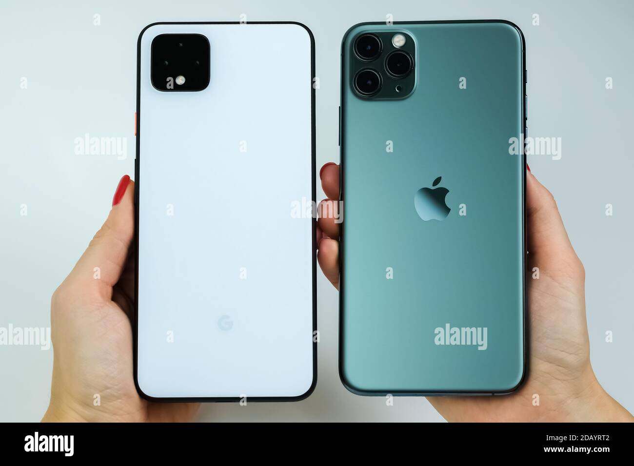 Google Pixel 4 Xl In Clearly White Color And Iphone 11 Pro Max In Midnight Green Stock Photo Alamy