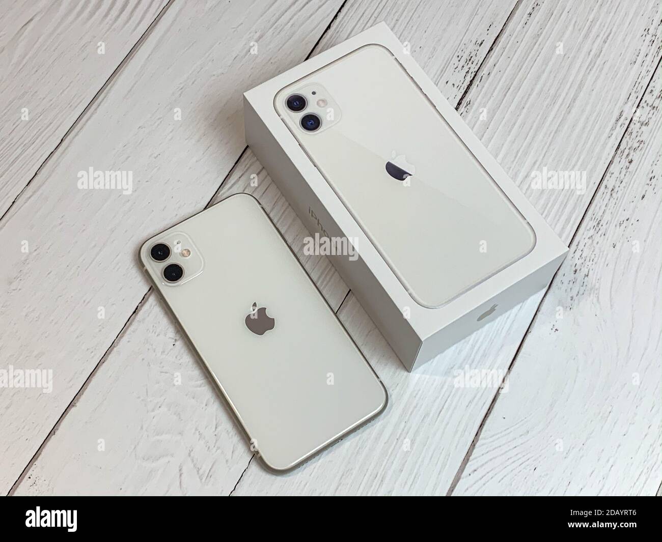 iPhone 11 in white next to its box Stock Photo - Alamy