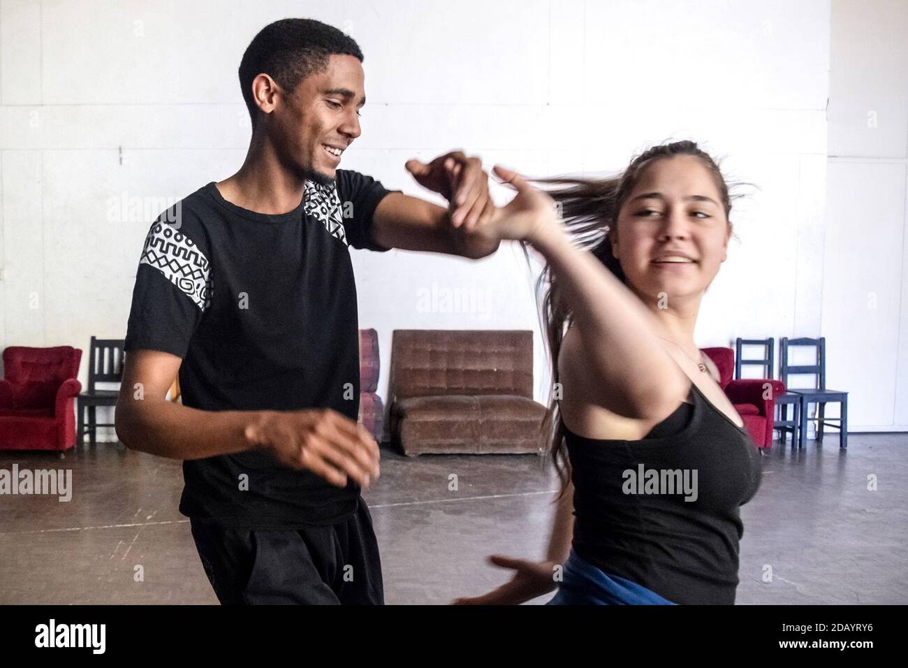 Fredrick King, 25, dances the bachata, a style originally from the Dominican Republic, with Roxane Smyth, 17, in Belgravia, Harare, Zimbabwe. Stock Photo