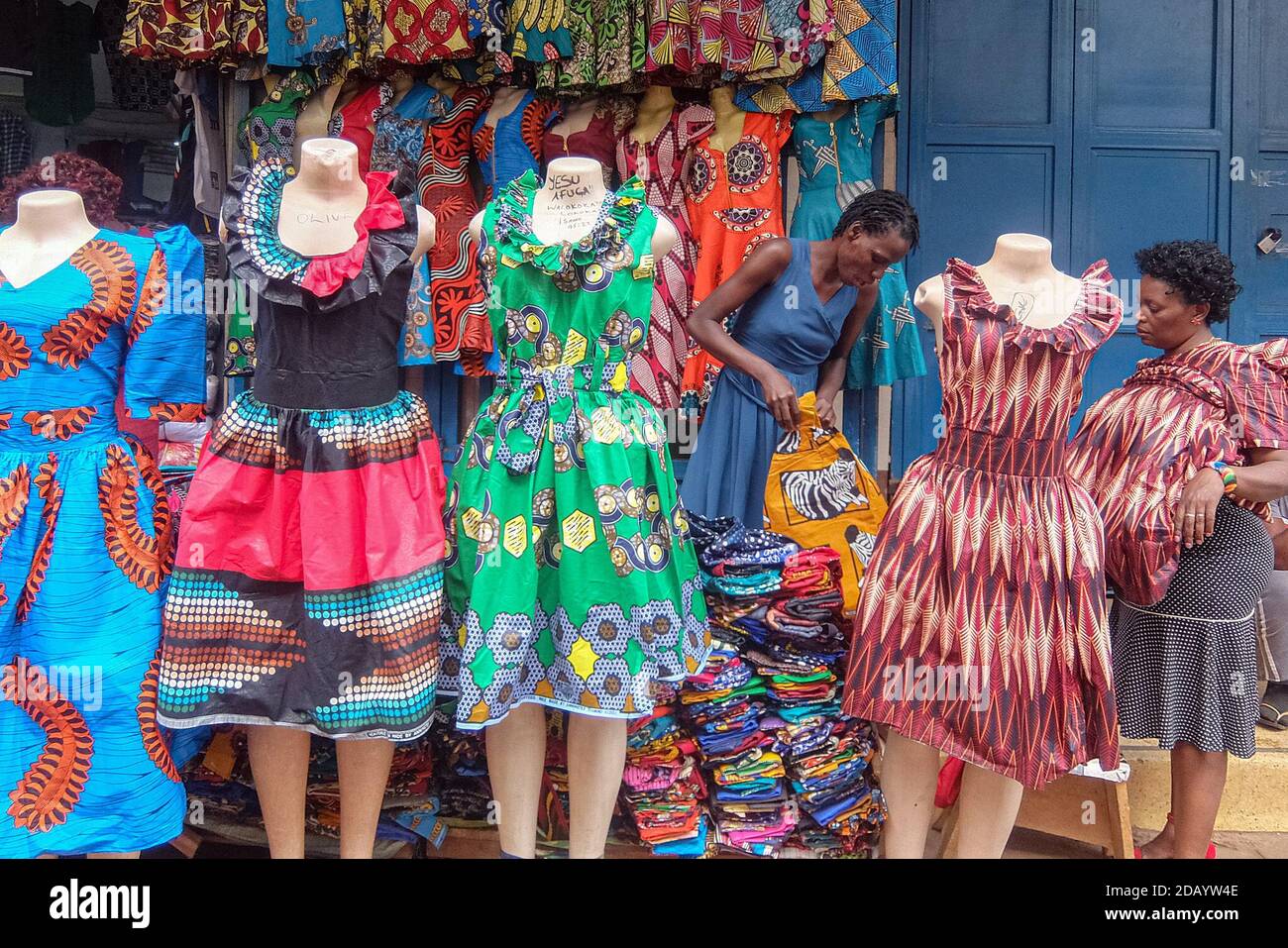 A vendor on Ben Kiwanuka Street in Kampala, Uganda, sells clothes made