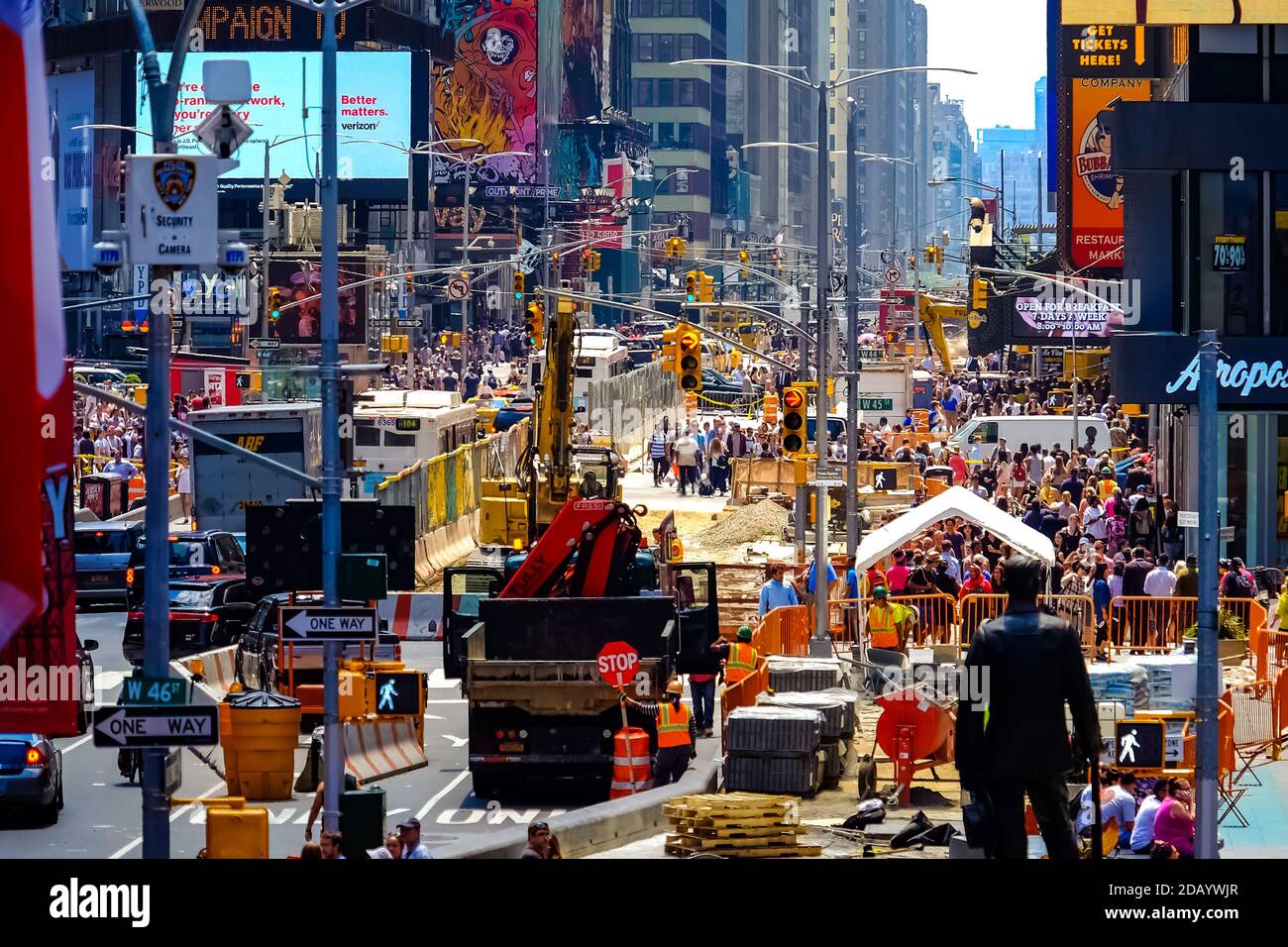 Times Square with yellow New York City Taxi cabs and tour buses driving