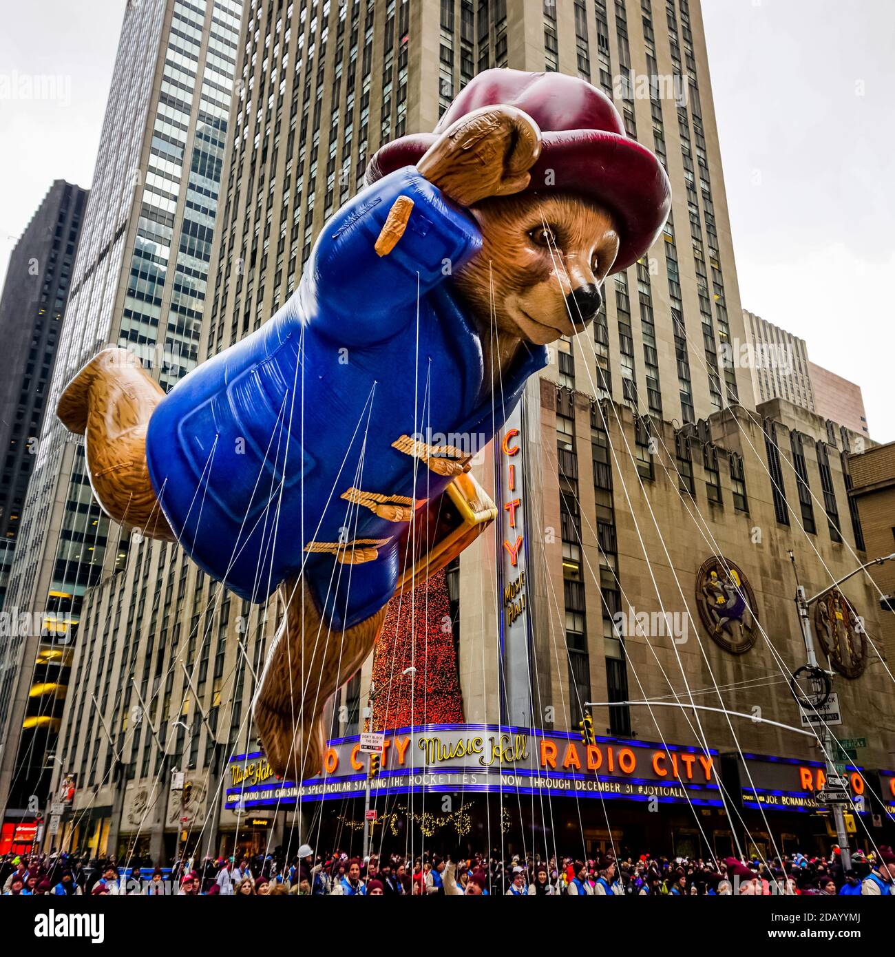 Paddington Bear balloon floats in the air during the Macy's Thanksgiving Day  parade along Avenue of Americas with Radio Music Hall in the background  Stock Photo - Alamy